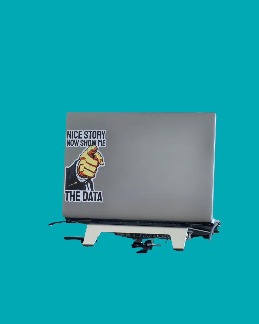Sticker on laptop reading: Nice story, now show me the data