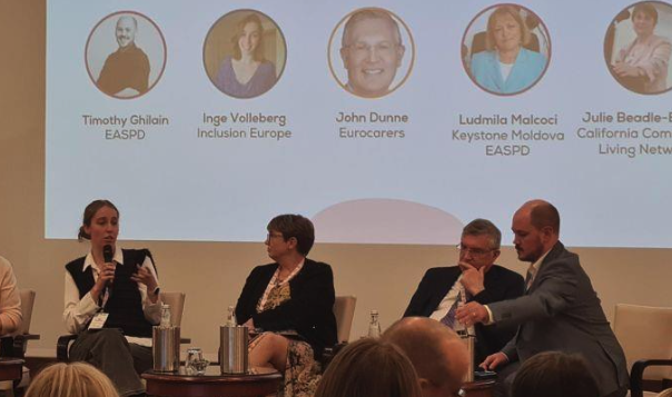 Inge on stage with other speakers
