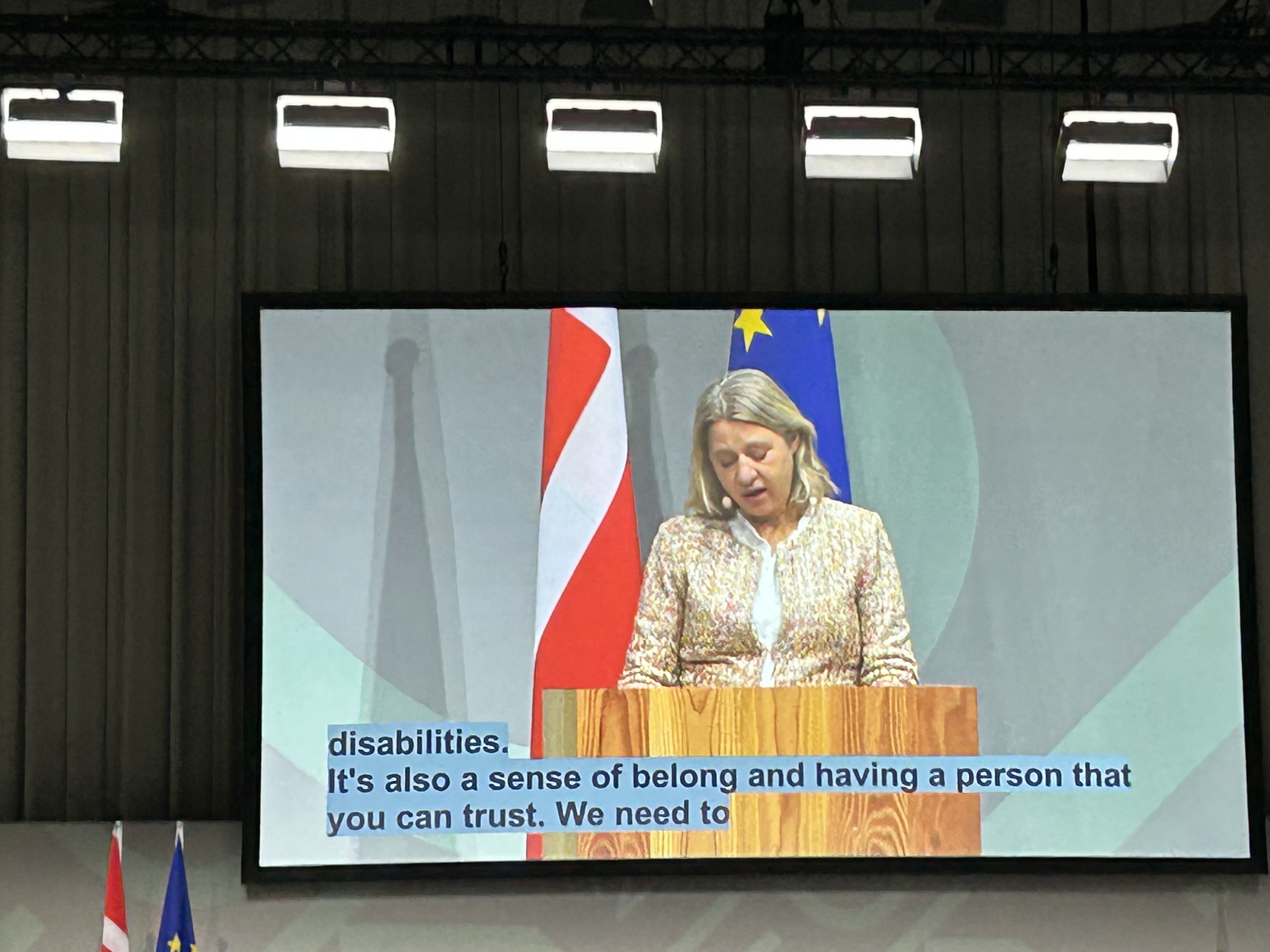 screen showing the minister and captions: is also a sense of belonging and having someone you can trust