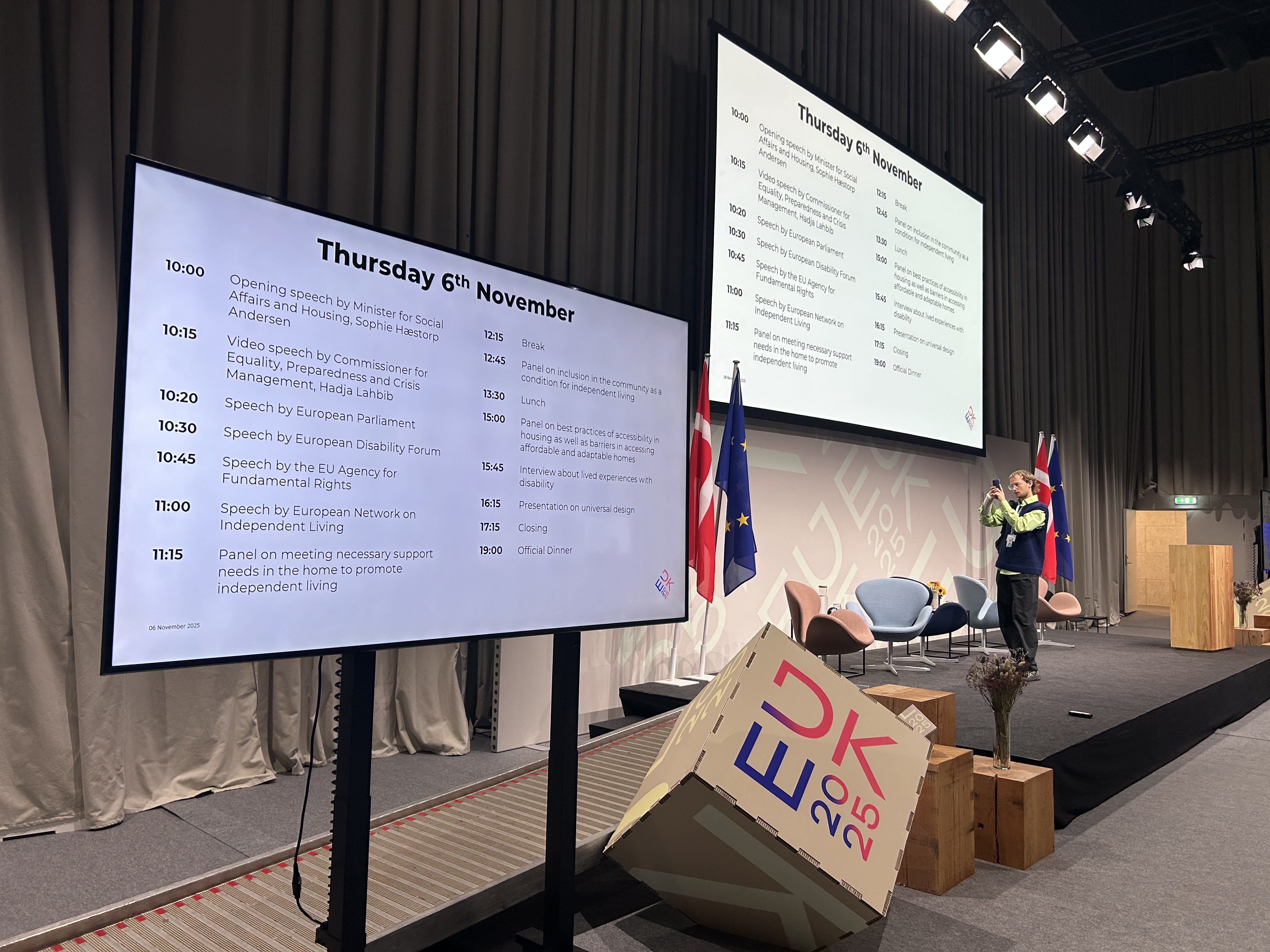 Stage and screens with conference agenda