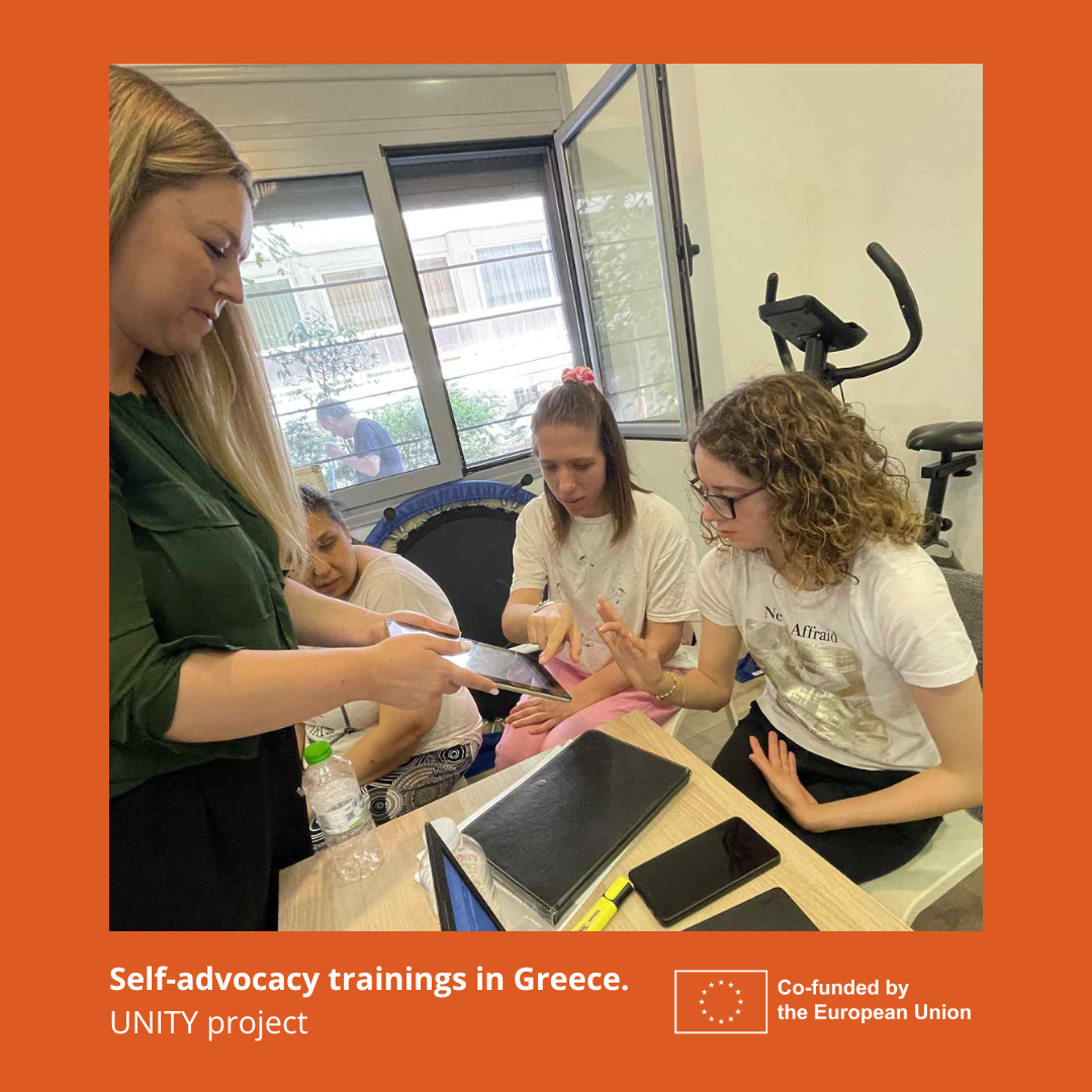 Participants in the self-advocates training, using tablets.