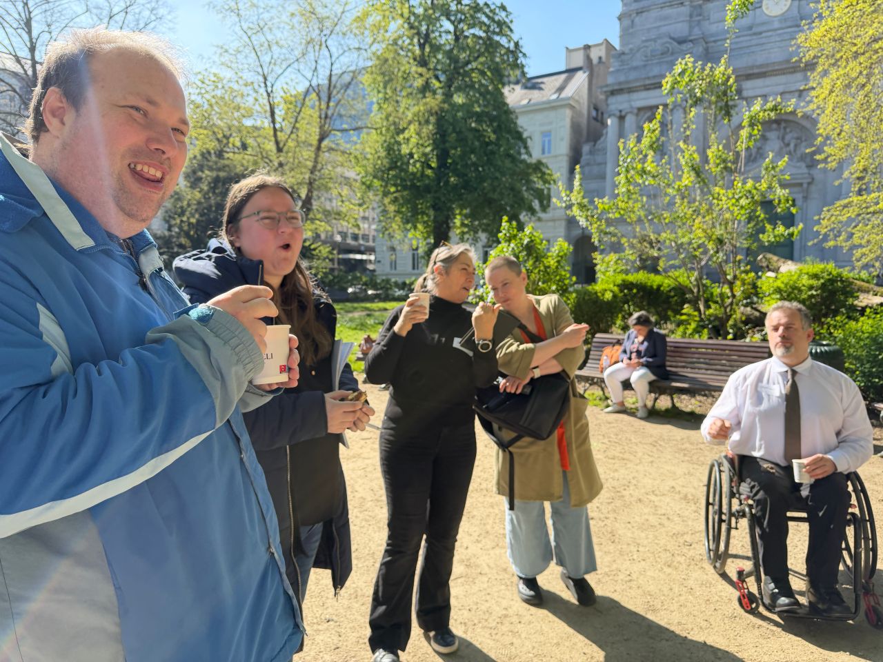 Participants asking and answering questions while outside in the park